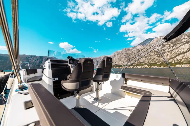 Rental speedboat cruising past the mountains of the Bay of Kotor Rental speedboat cruising past the mountains of the Bay of Kotor