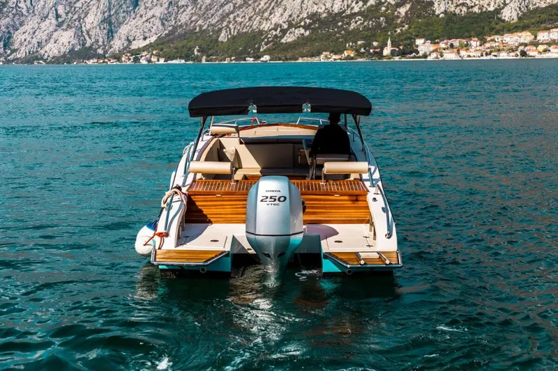 Don Amon luxury boat at sunset in the Bay of Kotor Don Amon luxury boat at sunset in the Bay of Kotor