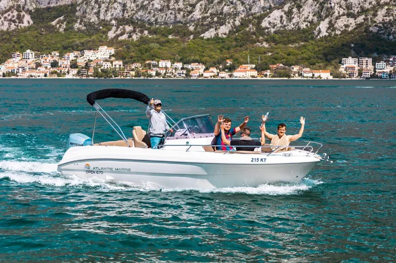 Guests aboard a rental speedboat cruising the Bay of Kotor Guests aboard a rental speedboat cruising the Bay of Kotor