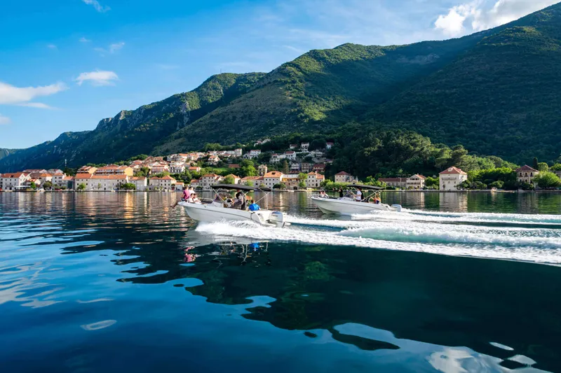 Mountains and medieval churches lining the Bay of Kotor, Montenegro Mountains and medieval churches lining the Bay of Kotor, Montenegro