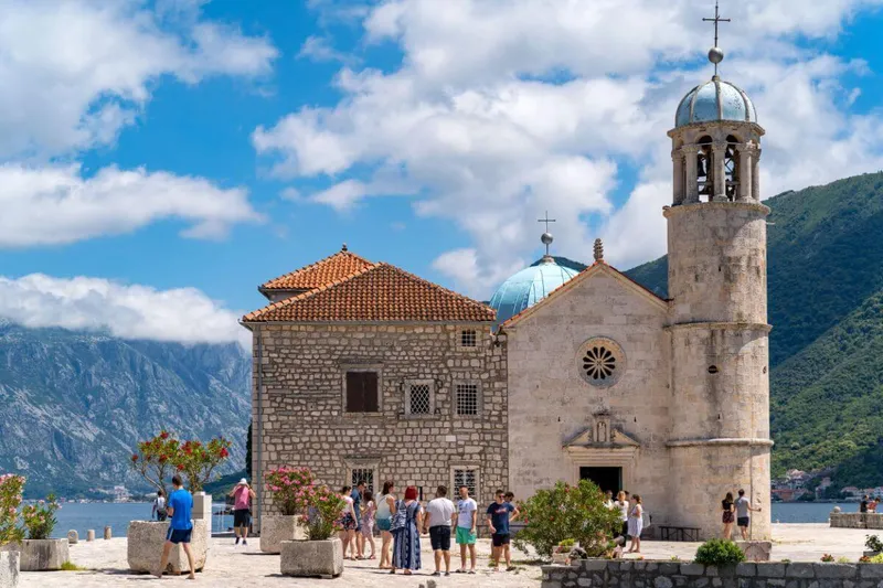 Scenic return cruise toward Kotor Old Town at golden hour Scenic return cruise toward Kotor Old Town at golden hour