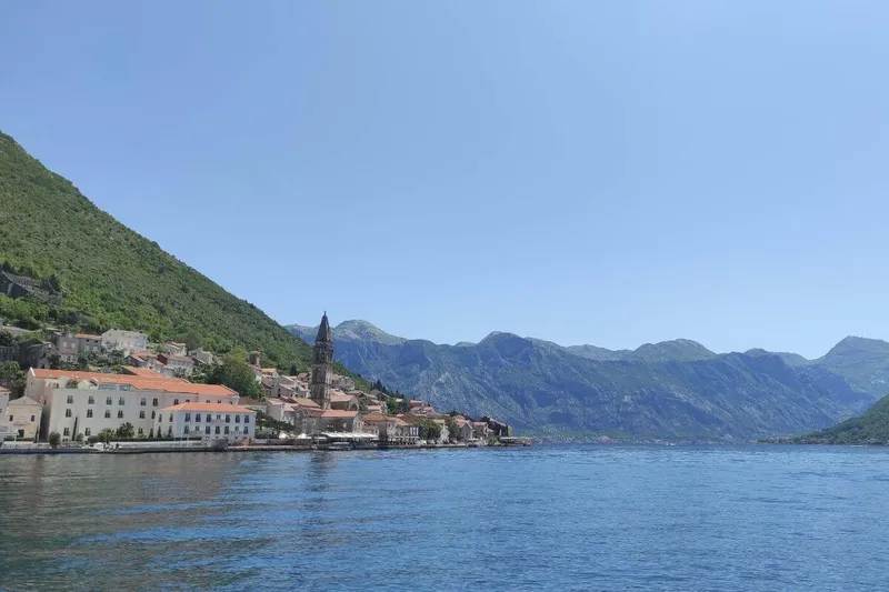 Passengers on a speedboat enjoying the scenic Bay of Kotor cruise Passengers on a speedboat enjoying the scenic Bay of Kotor cruise